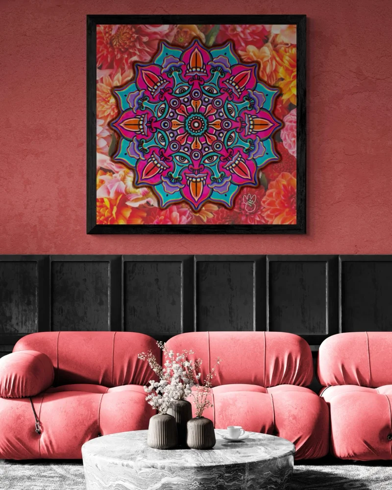 A mock-up of a pink and blue mandala illustration titled 'Shiva Shakti Mandala' on a salmon pink wall with black panels below. The room has pink chairs and a granite stone table with a vase of flowers. 