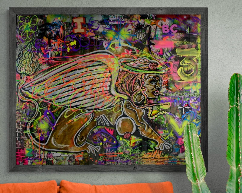 A mock-up of Kim's artwork titled 'Allegory' which shows an image of a Sphinx surrounded by abstract fluorescent markings. The image is in a room with an orange sofa and cactus.