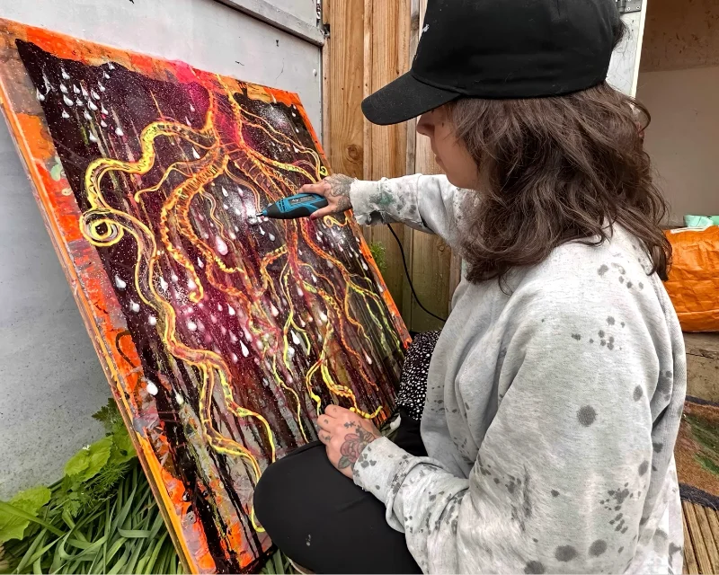 Kim outside her art studio working on the piece titled 'Antagony'