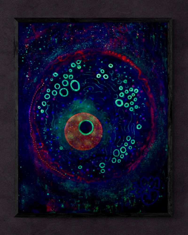 The artwork titled 'Division' from Kim's Pine collection, as it appears under ultra-violet light. The figurative representation of the cell is glowing.